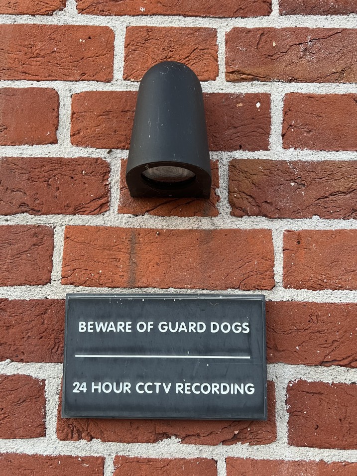 Outside many a house on this road are plaques which read 'beware of guide dogs' and '24 hour CCTV footage'