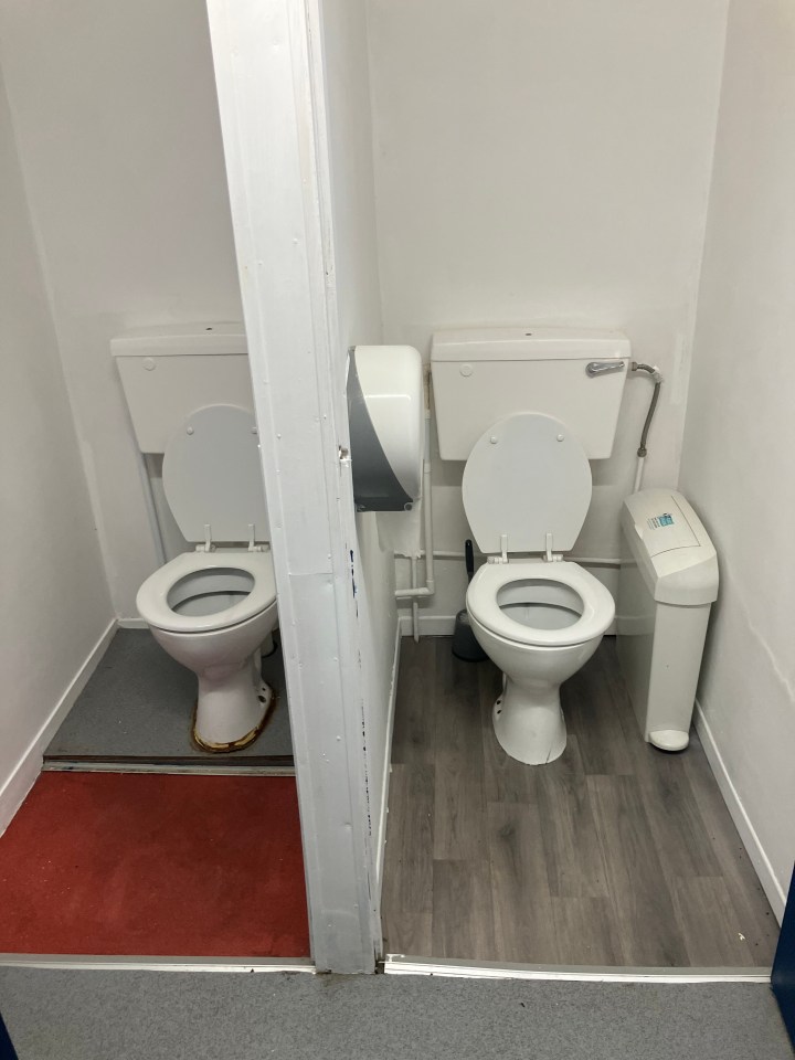 Two toilets in a restroom.