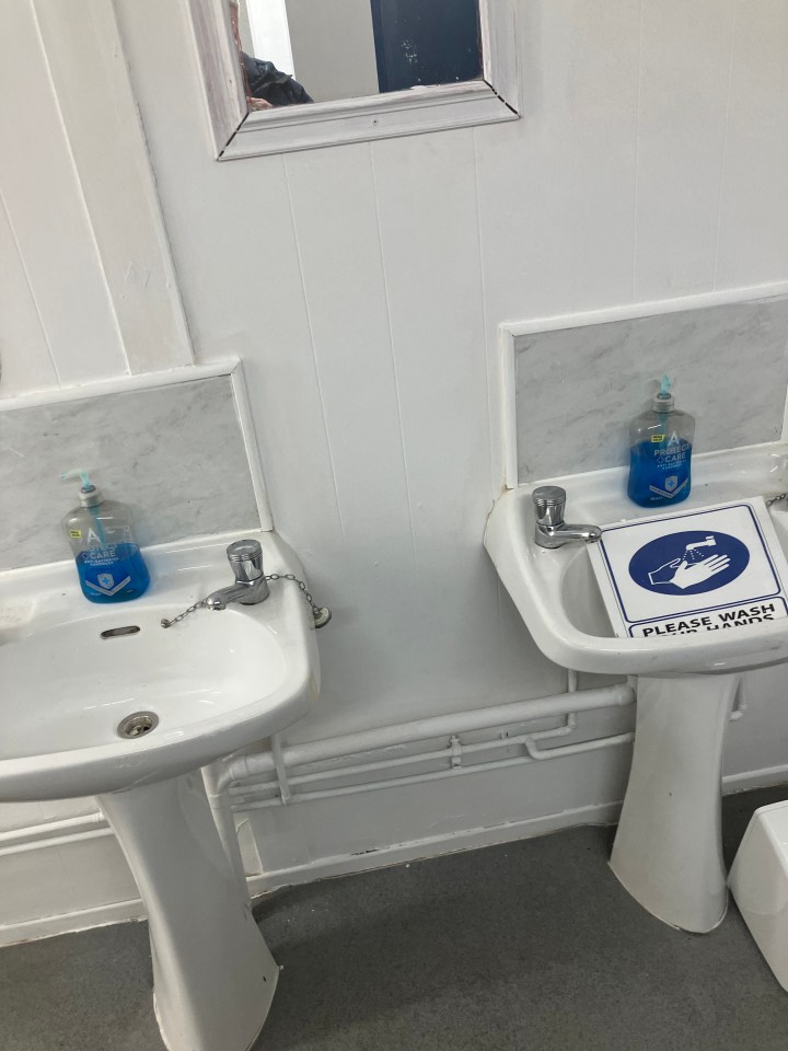 Two sinks with hand soap and handwashing instructions.