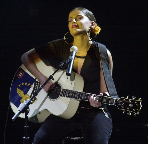 Nelly Furtado performing "I'm Like A Bird" at a concert.