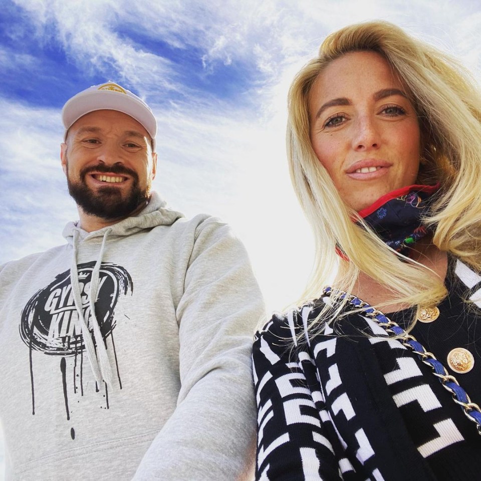 Portrait of a man and woman smiling at the camera.