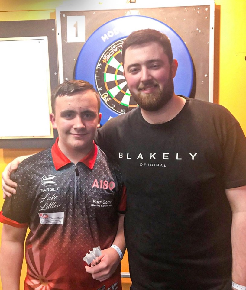 Luke Littler and Luke Humphries at a darts tournament.