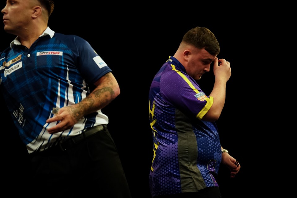 Luke Littler and Gerwyn Price during a darts match.