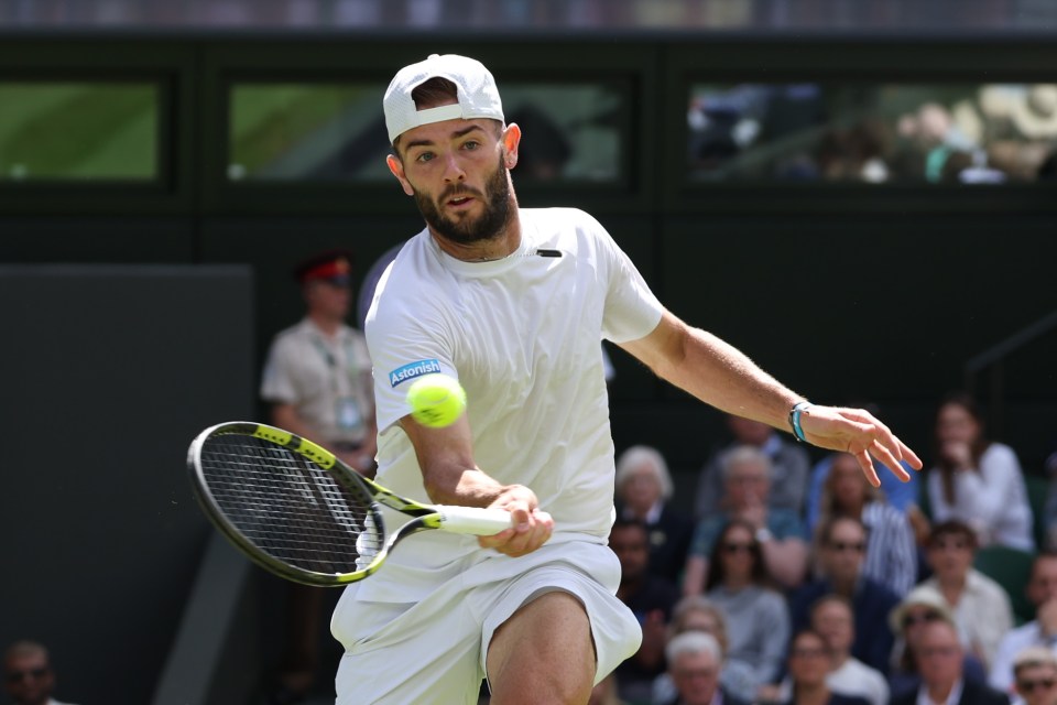 Jack Fearnley playing tennis.