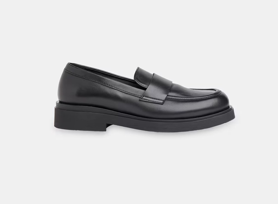 Black leather penny loafers with a chunky sole.