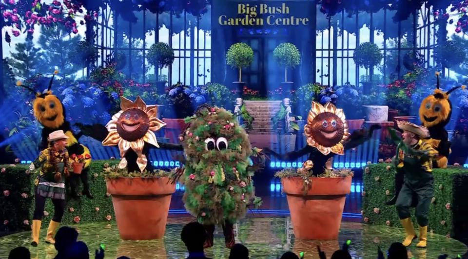 The Masked Singer: Bush, costumed performers as sunflowers, a bush, and bees.