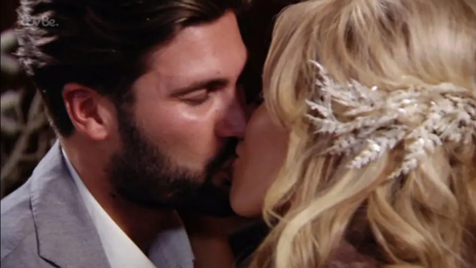 Dan Edgar and Kate Wright kissing.