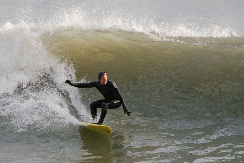 Surfer riding a wave.