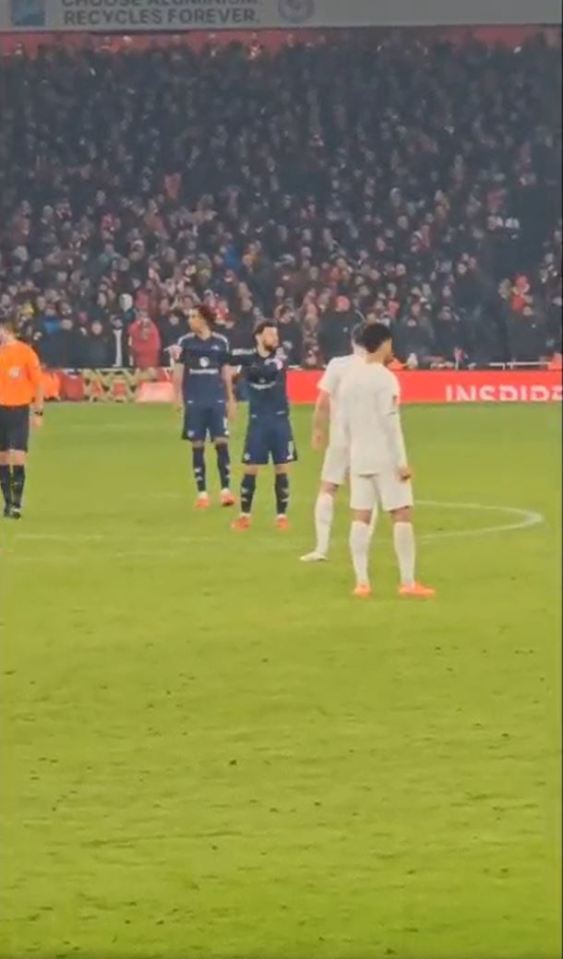 Soccer players on a field during a game.