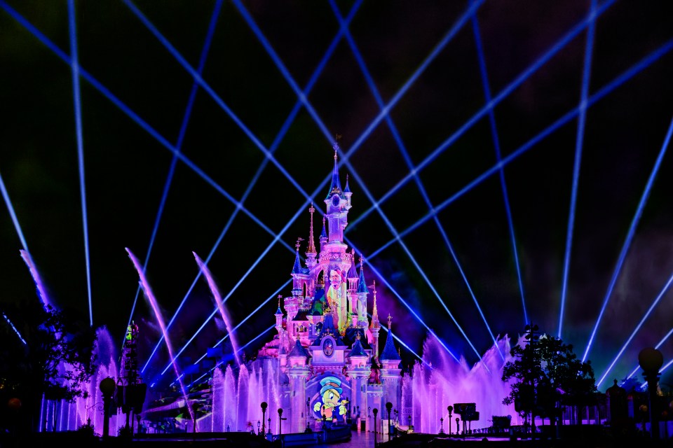 Sleeping Beauty Castle light show with water fountains.