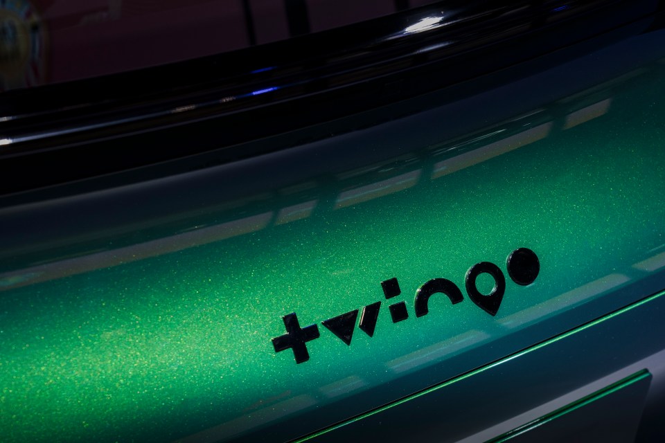 +vino logo on a green car.