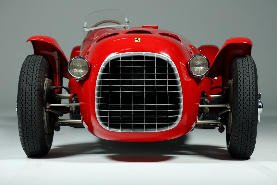 Front view of a red Ferrari race car.