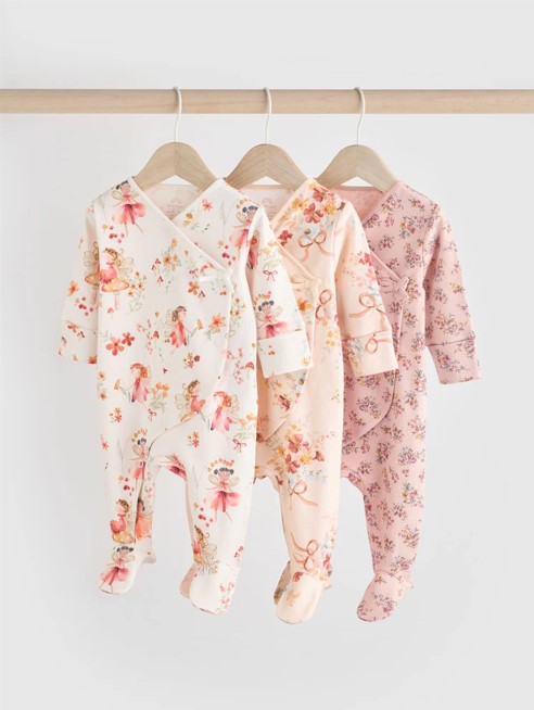 Three baby onesies with floral prints.