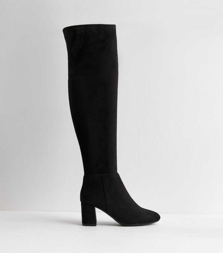 Black over-the-knee boots with block heels.