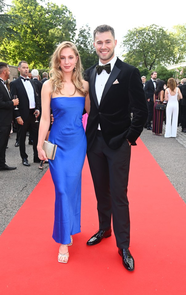 Sophie Sheridan and Curtis Pritchard on a red carpet.