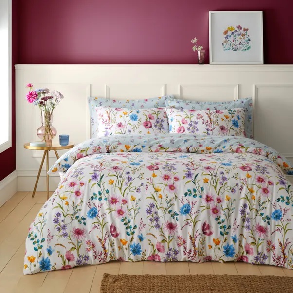 Floral duvet cover set on a bed.