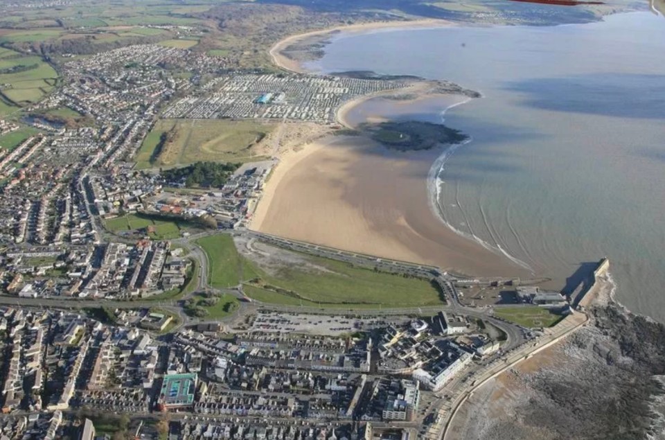 Aerial view of Porthcawl, Wales, showing the town, beach, and coastline.