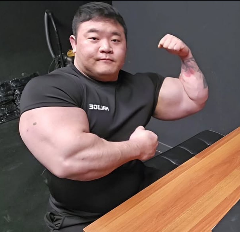 Bodybuilder flexing his arm.