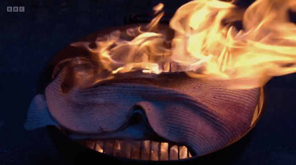 Fabric burning in a grill.