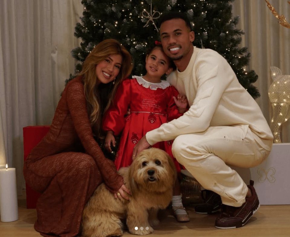 Family Christmas photo with dog.