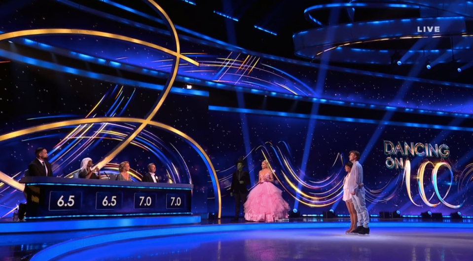 Screenshot of Dancing on Ice judging panel and contestants.