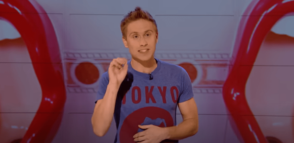 Man in a blue "Tokyo" t-shirt gesturing.