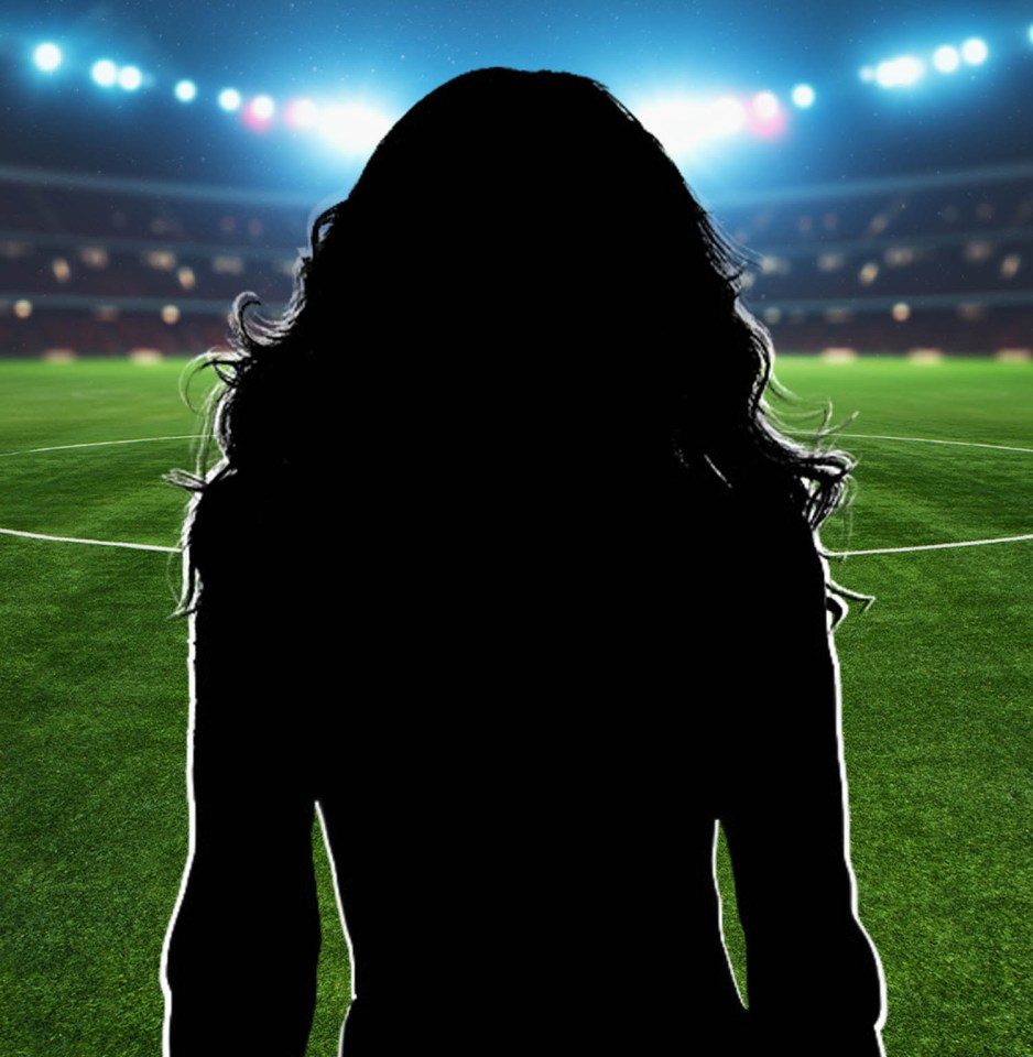 Silhouette of a woman in front of a soccer field.