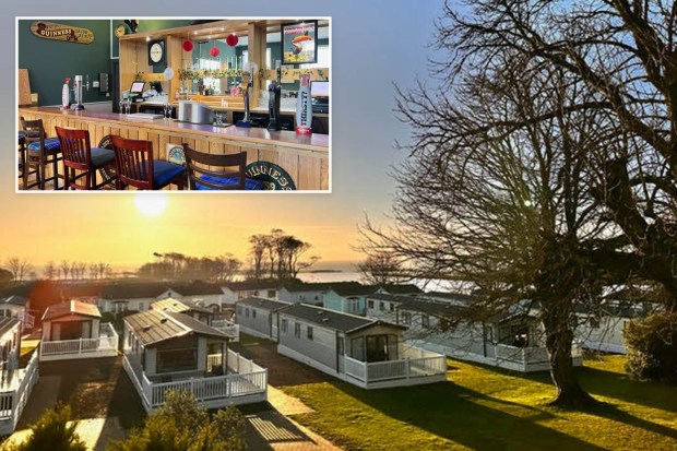 Park with bar and mobile homes at sunset.