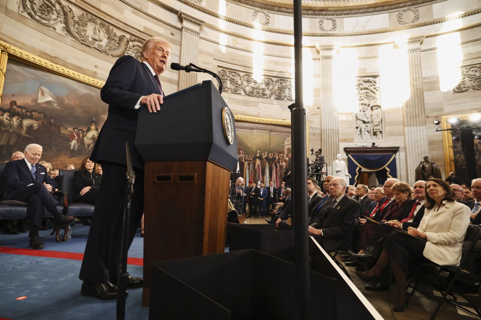 President Donald Trump speaking at a podium.