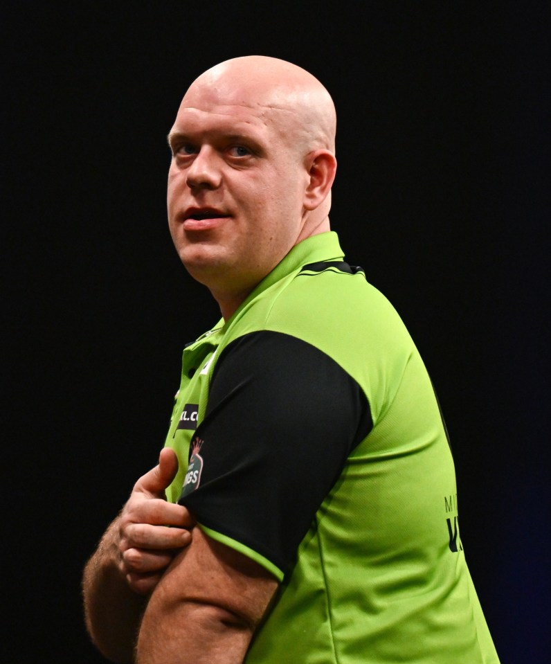 Michael van Gerwen reacting during a darts match.