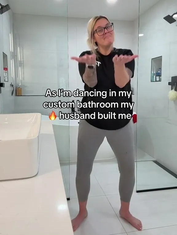 She dances around her custom built bathroom built