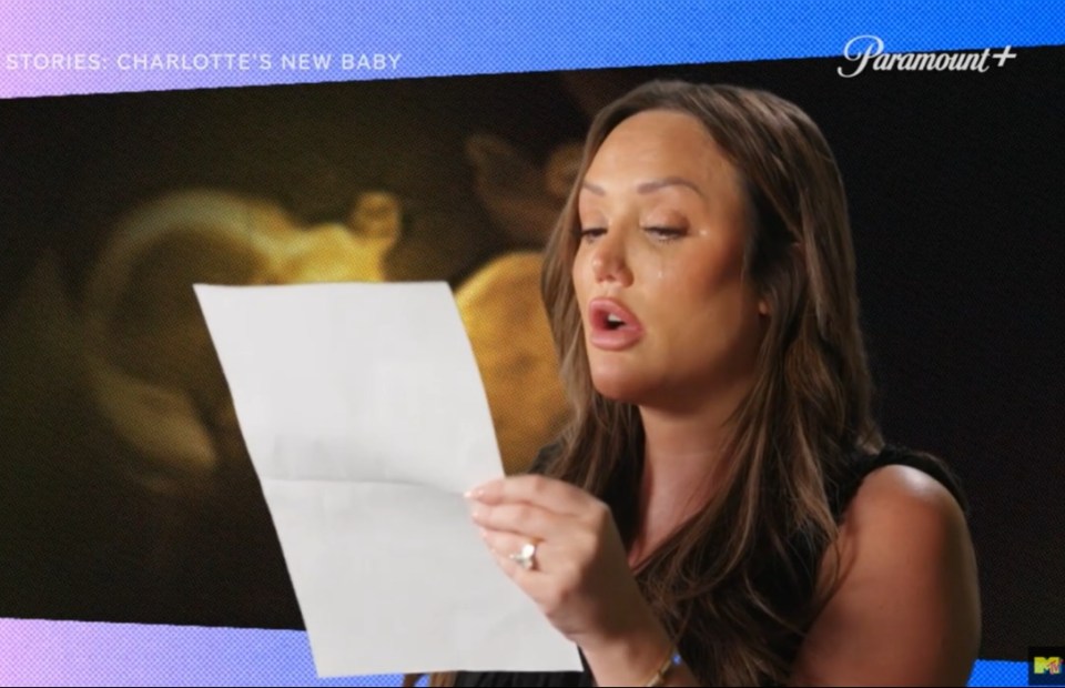 Charlotte Crosby crying while reading a letter.