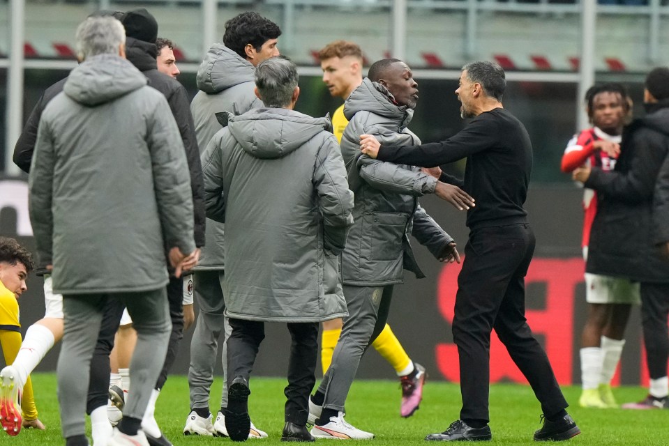 AC Milan's head coach arguing with a player.