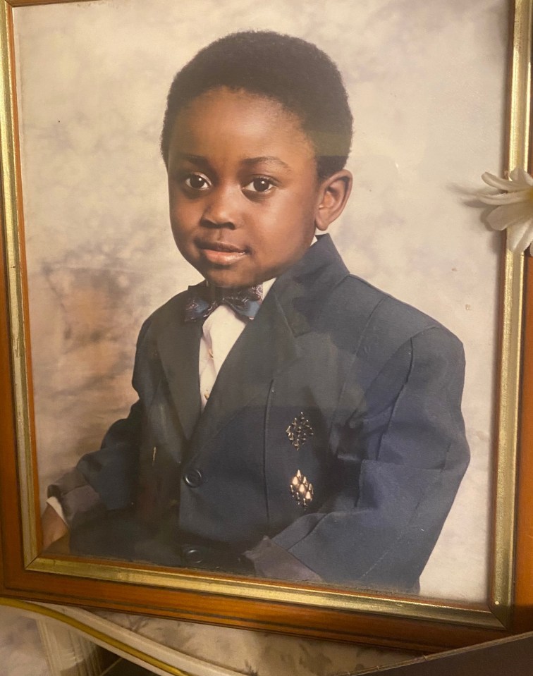 Framed photo of a young boy in a suit.