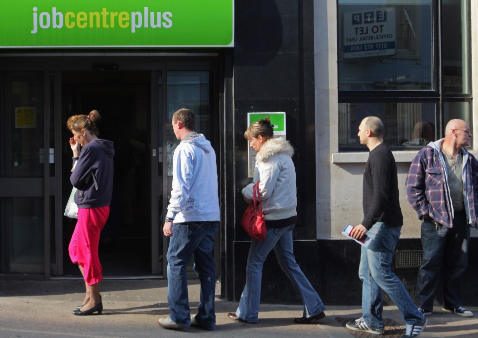 People queuing outside a Job Centre Plus.