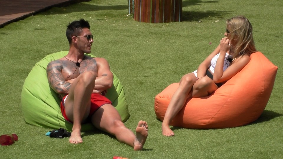 Two Love Island contestants sitting in beanbag chairs.