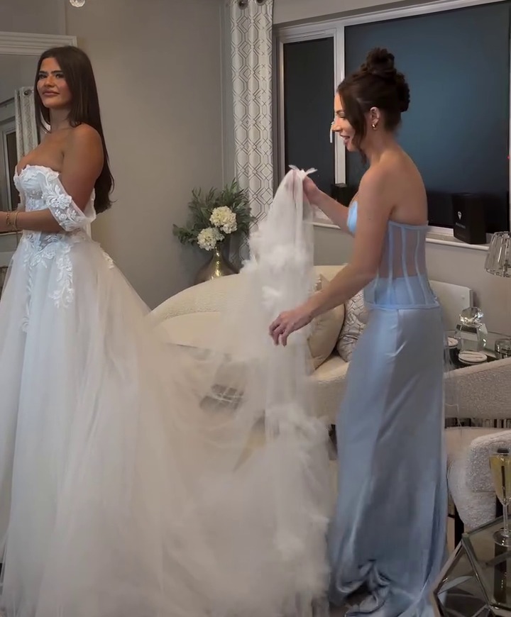 Matilda Draper trying on wedding dresses.