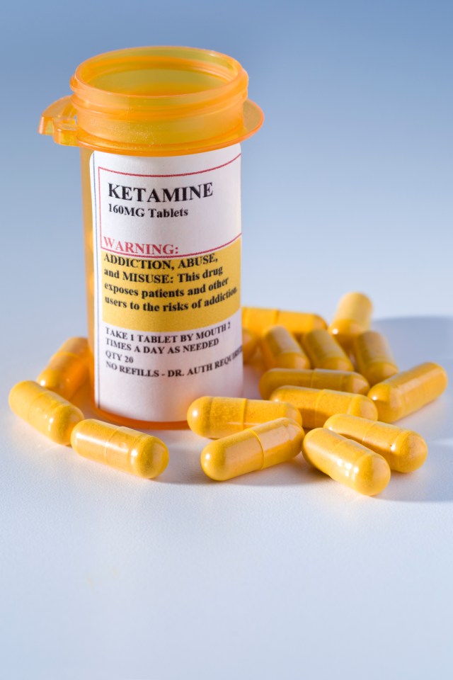 Prescription bottle of Ketamine with warning label about addiction.