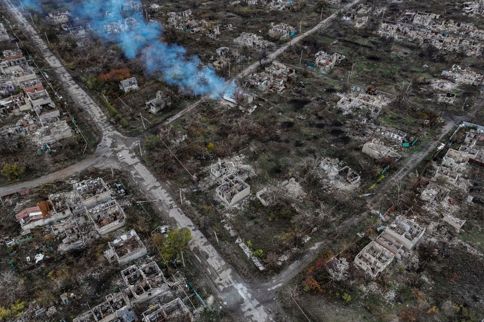 Aerial view of ruined buildings and smoke in Chasiv Yar, Ukraine.