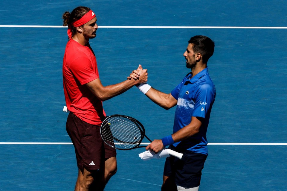 Alexander Zverev and Novak Djokovic shaking hands after a tennis match.