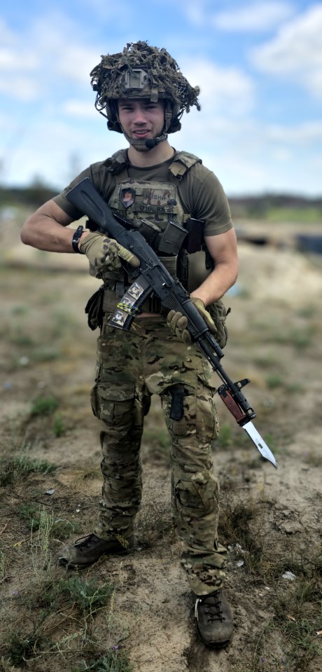 Ukrainian soldiers firing a howitzer.