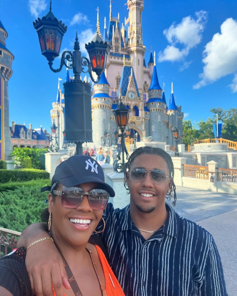 Alison Hammond and her son in front of Cinderella Castle at Disney World.