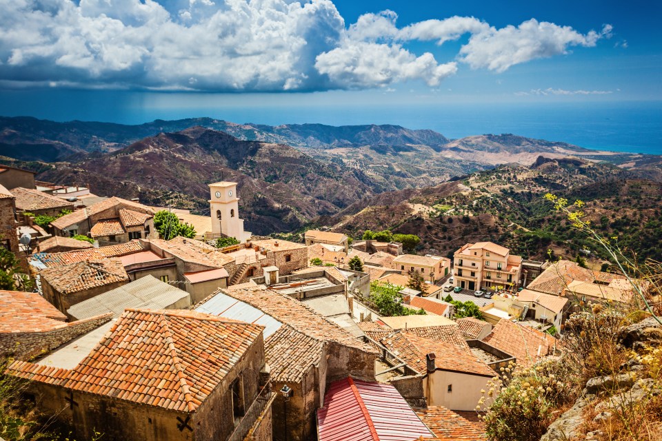 Aerial view of Bova Superiore, Italy, overlooking the Mediterranean Sea.