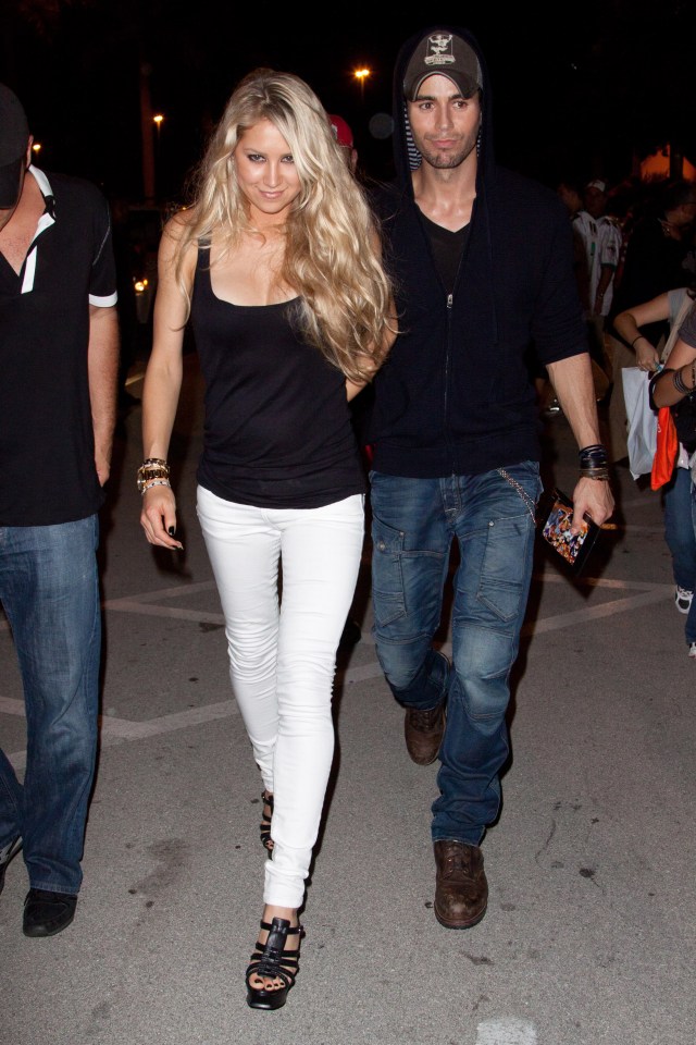 Anna Kournikova and Enrique Iglesias leaving a Miami Dolphins game.