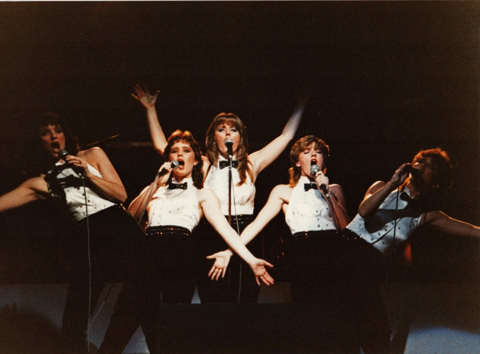 The Nolans performing on stage.