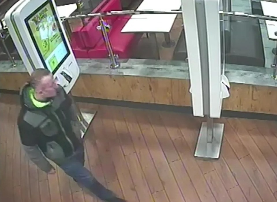 CCTV image of Stuart Thomson near a self-service kiosk.