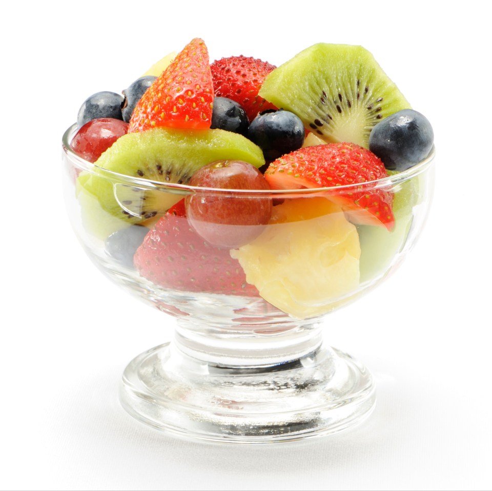 Fruit salad in a glass bowl.