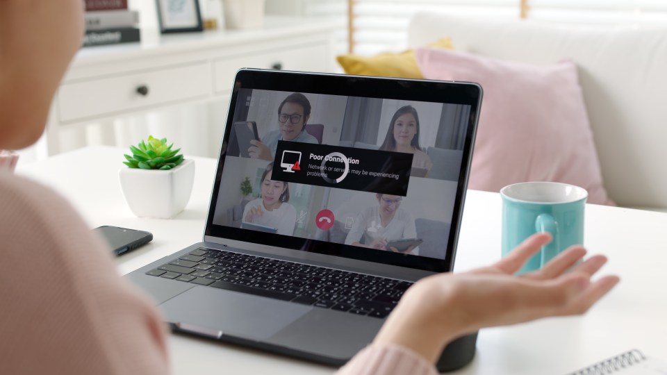 Woman experiencing poor internet connection during a video conference.