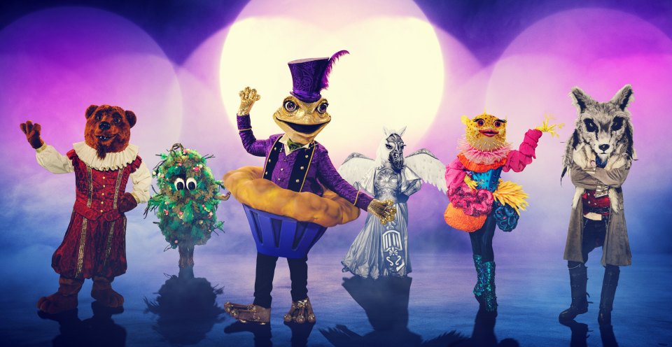 Promotional image of The Masked Singer contestants: Bear, Bush, Toad, Pegasus, Pufferfish, and Wolf.