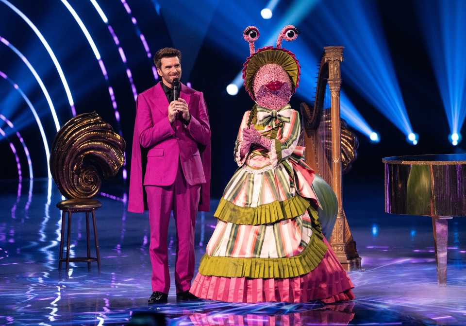 Joel Dommett and the Snail contestant on The Masked Singer.